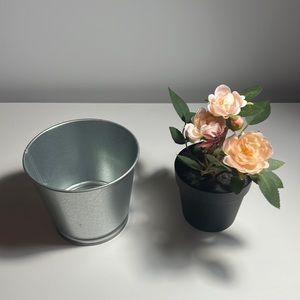 Pink fake flowers with pot